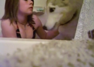 Cute student getting affectionate with her pet