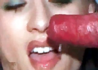 Slutty babe sucks on a big red cock